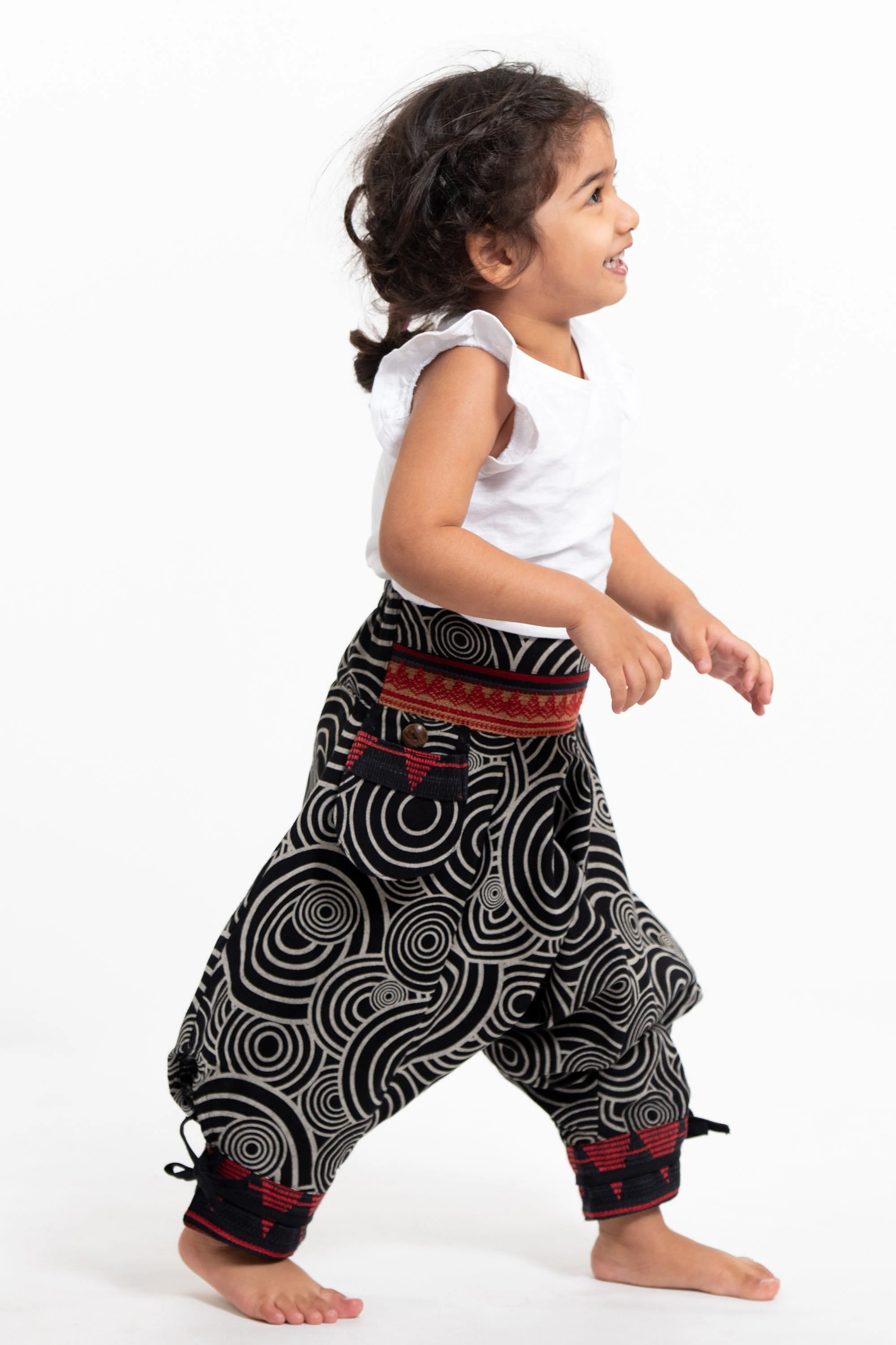 Swirls Prints Thai Hill Tribe Fabric Kids Harem Pants with Ankle Straps in Black - Image 3